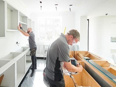 Installers fitting countertops